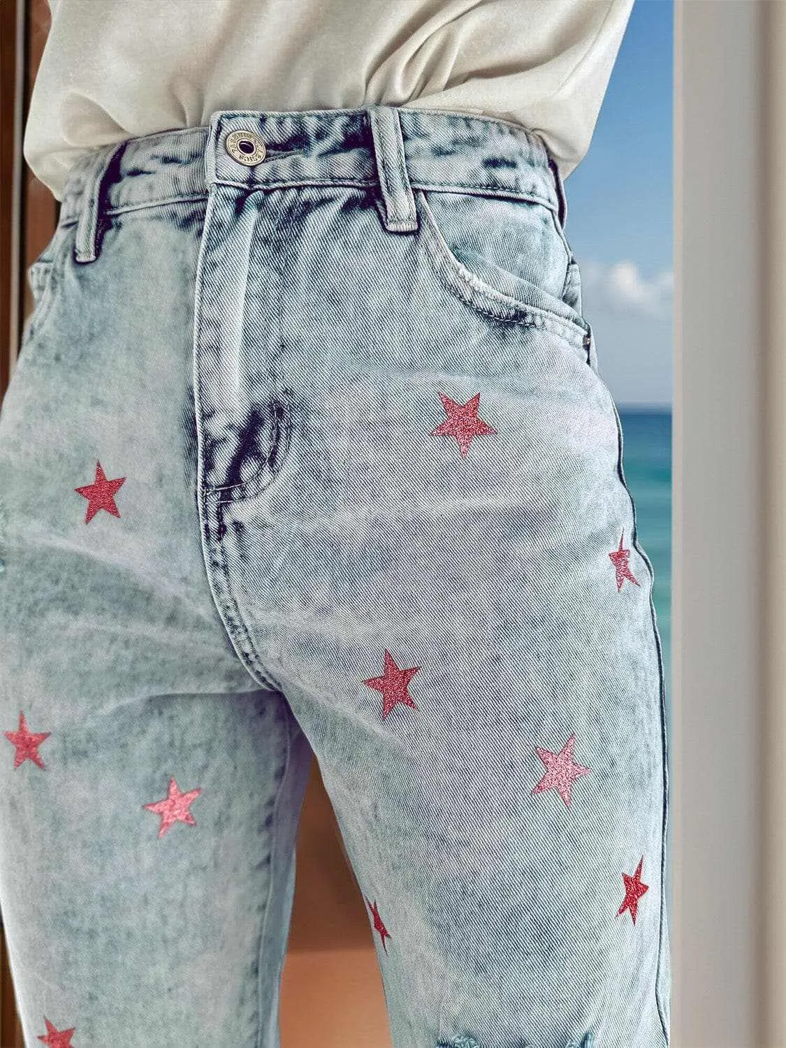 Distressed star pocket jeans